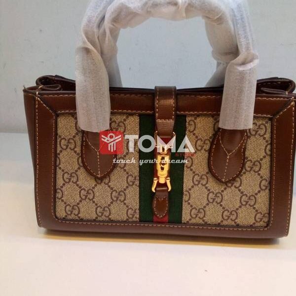small tote with piston closure in beige gg canvas leather abg