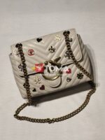 mini love broches quilted bag in leather