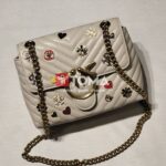 mini love broches quilted bag in leather