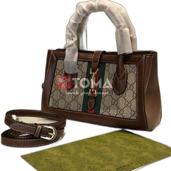 small tote with piston closure in beige gg canvas leather abg