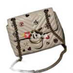 mini love broches quilted bag in leather